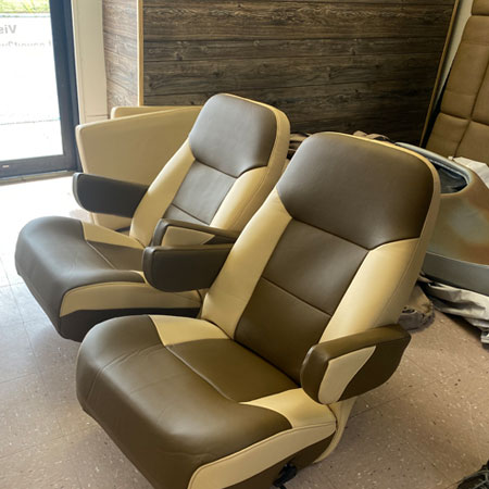 brown and tan upholstered boat chairs
